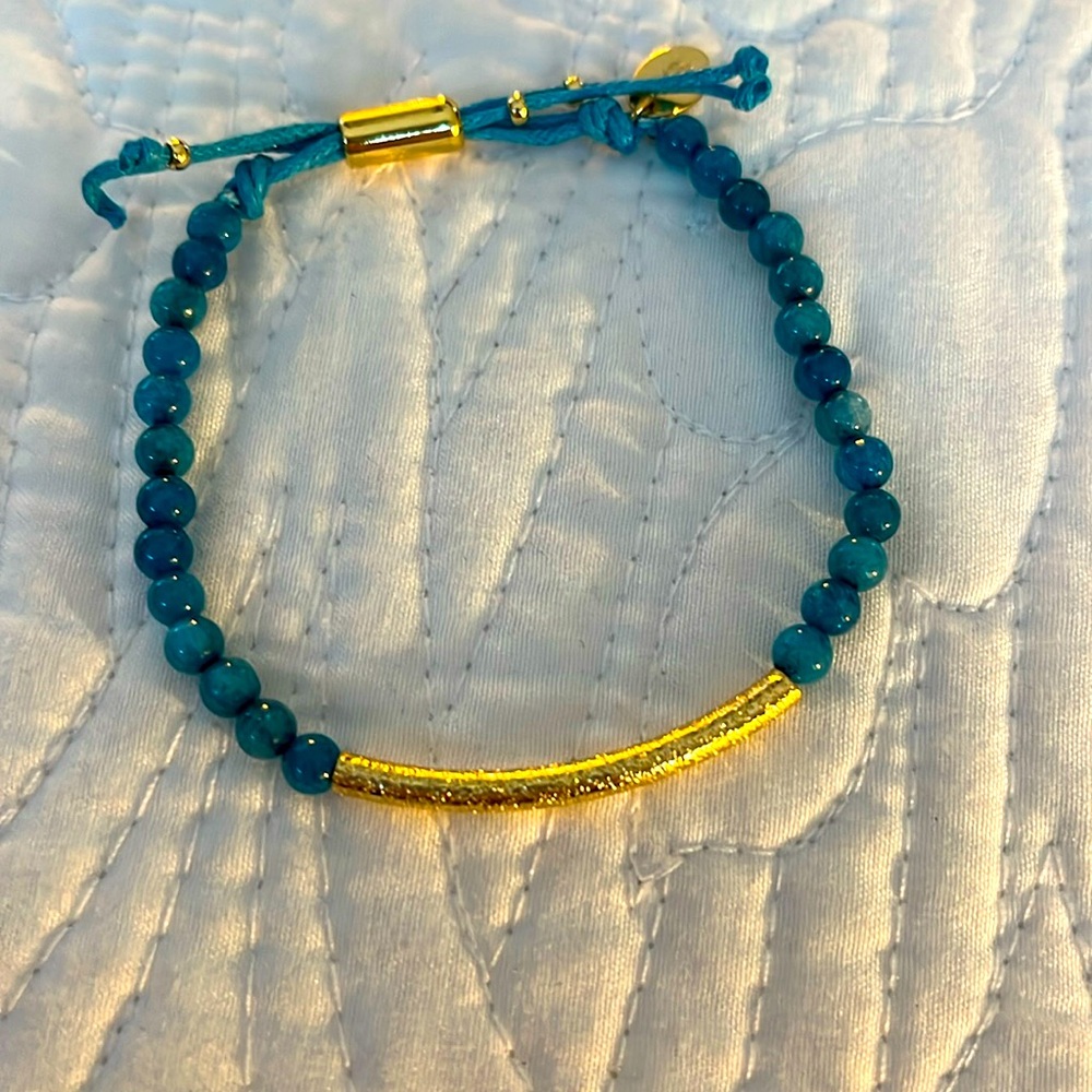 Sterling Forever bracelet with gold tone accents and blue stones.